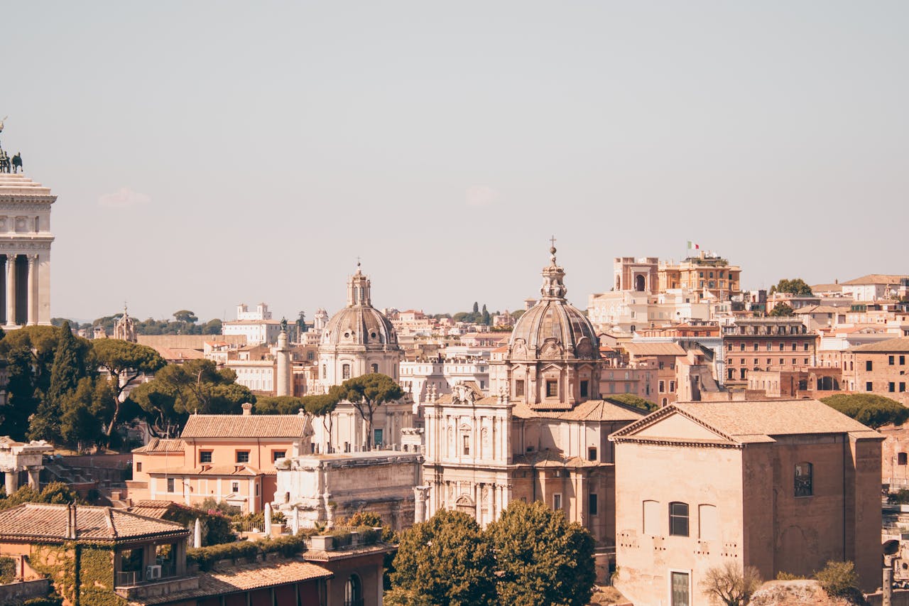 Scenic aerial view of Rome's historic cityscape with iconic domes and architecture.